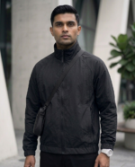 Black zip-up windbreaker jacket with relaxed fit and premium stitching available at Ranjana Complex Nepal.